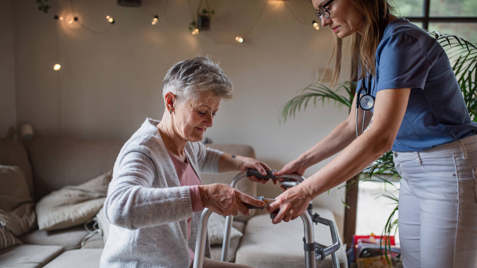 Nurse helping reminding a man to take his medication.